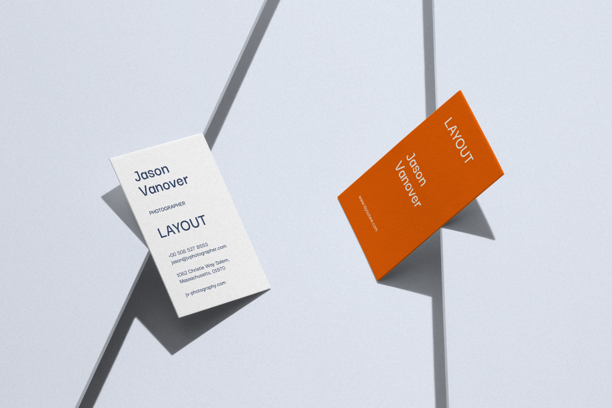 Two business card, one is white, another is orange. Both using 300gsm woodfree paper